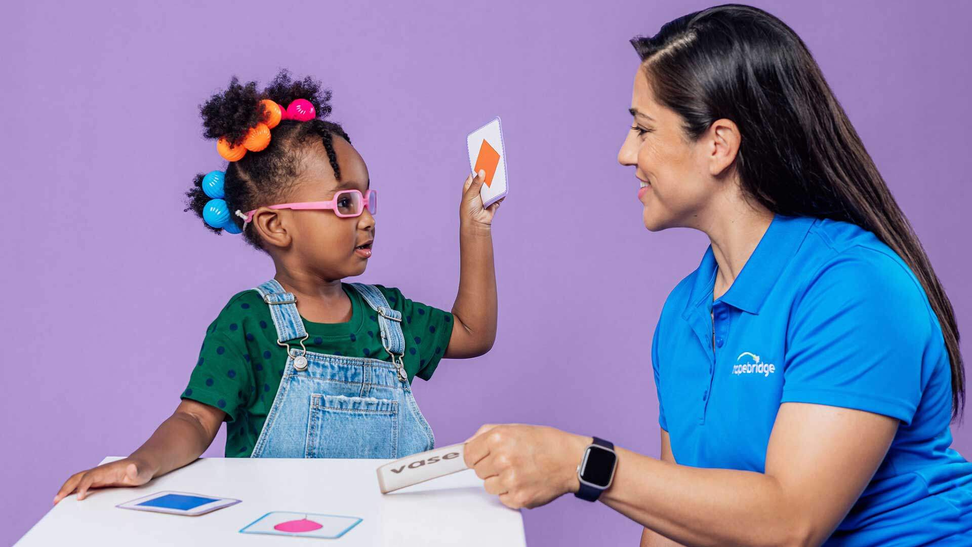 Hopebridge brand photography with a staff member playing Vase with a child